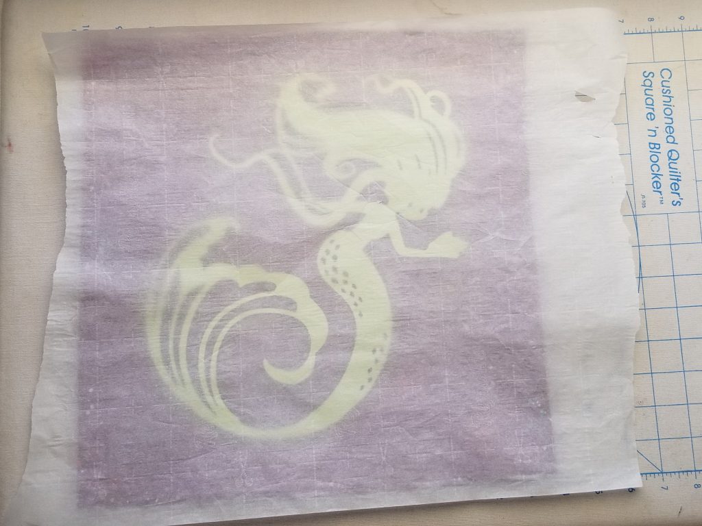parchment paper over heat transfer vinyl