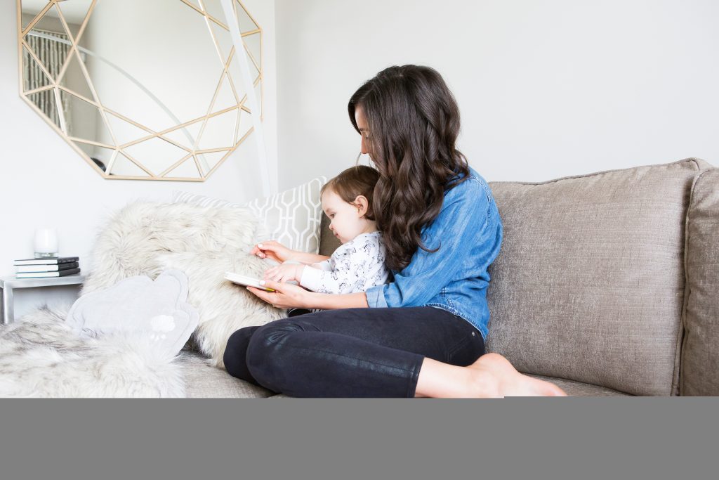 Mom sitting with her baby on the computer